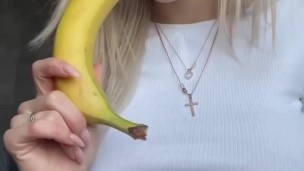 Huge breasted blonde sexy eating banana