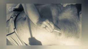 He smokes a cigarette and licks his lover’s nipples