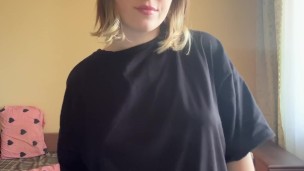 Beautiful brunette in a t-shirt shows off her panties