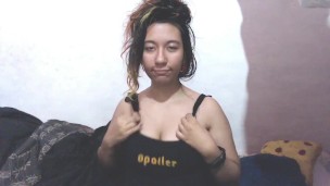 E-girl massages her head and shakes her breasts, they jump out ..